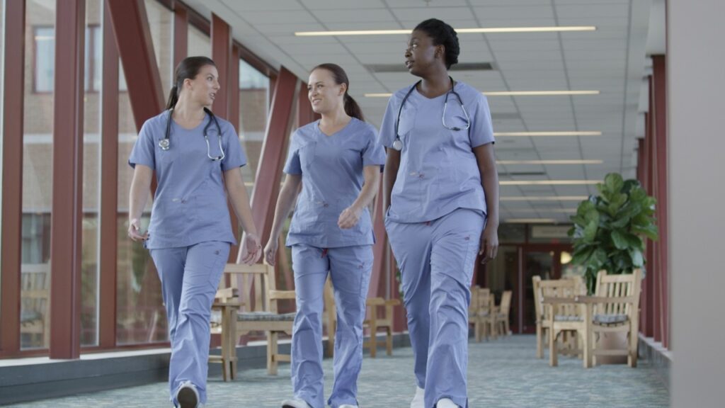Nurses walking down a hallway