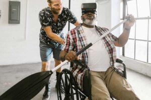 man-in-wheelchair-using-vr-glasses-mimic-rowing-a-boat 