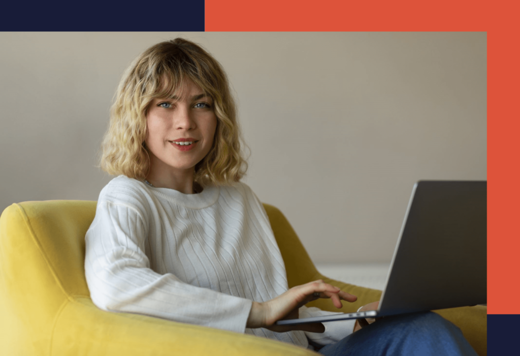 Side view of a woman working on a laptop