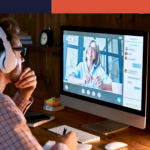 Male student wearing headphones taking online course training, watching webinar, remote seminar university class, virtual learning with social distance web teacher, tutor or coach on computer screen.