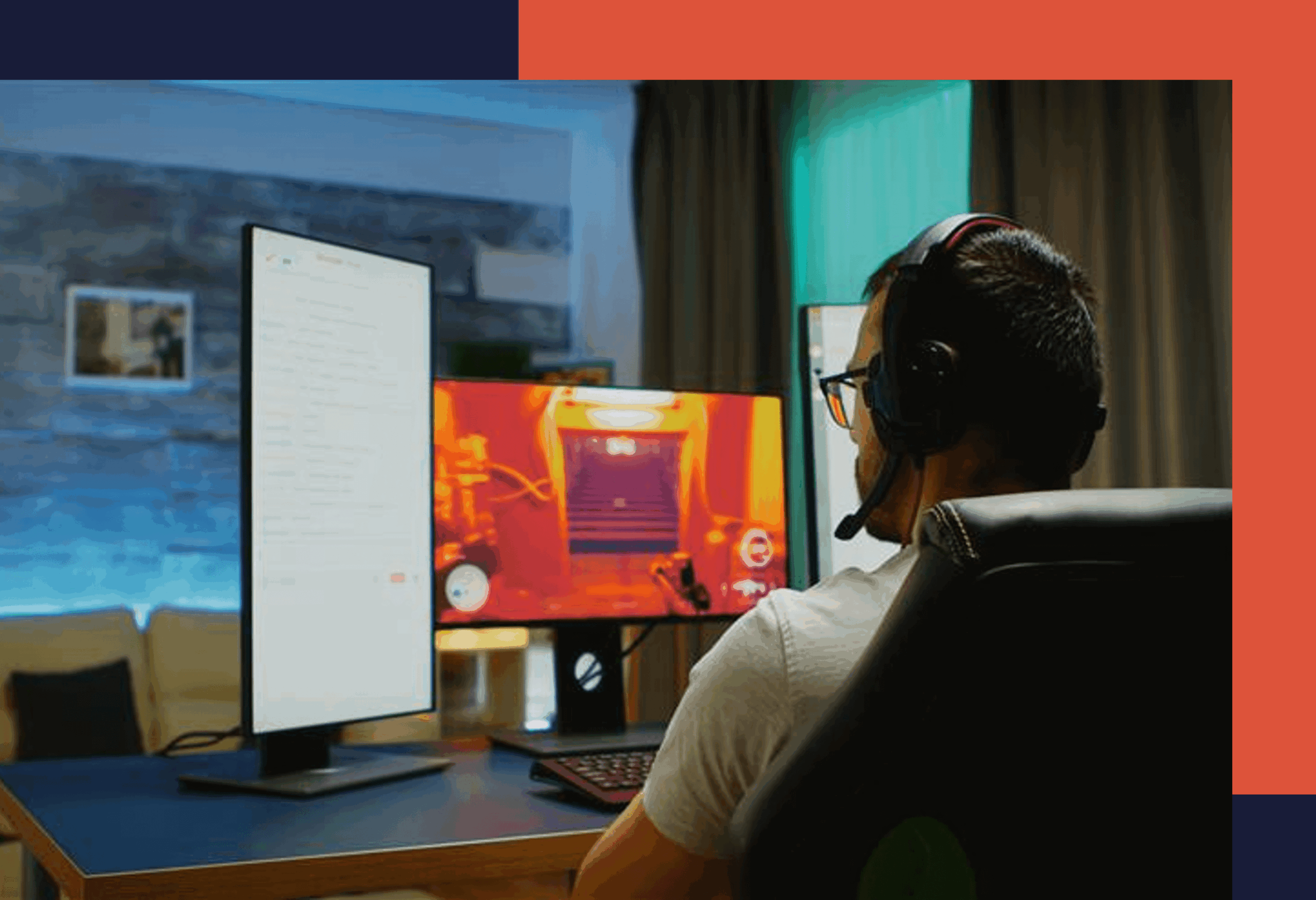Man sitting at desk playing games on computer