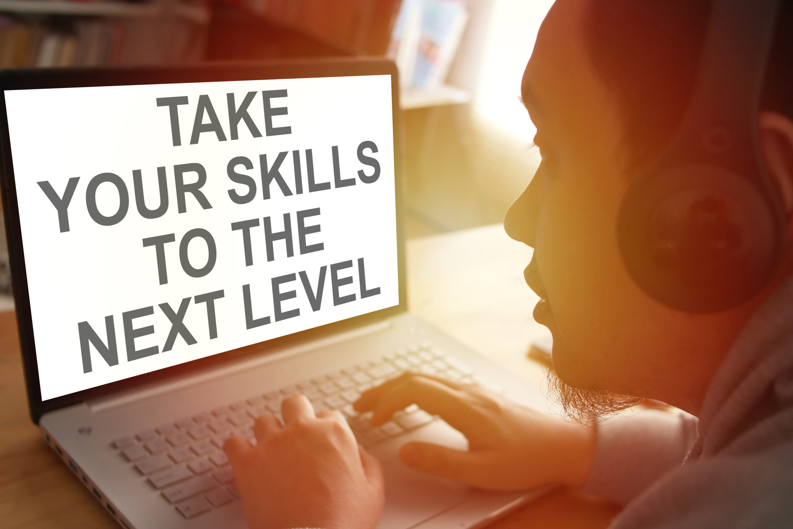 Man sitting at a computer screen learning about skills