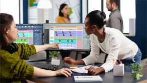 Two Instructional Designers working together on a computer screen.