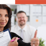Business woman holding a file that says: Accreditation and giving a thumbs up.